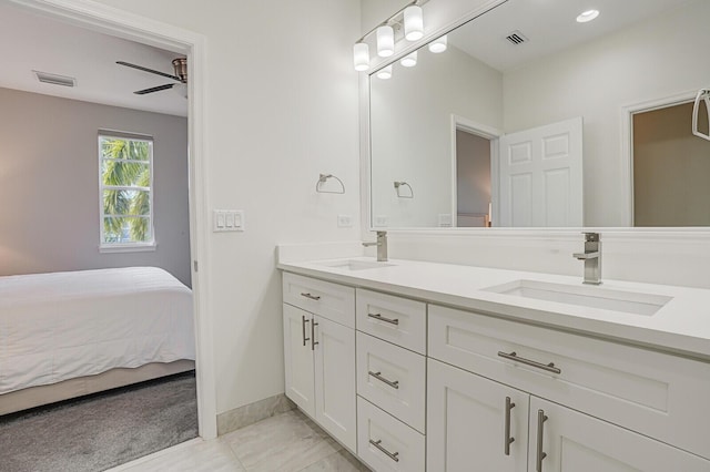 bathroom with tile patterned floors, vanity, and ceiling fan