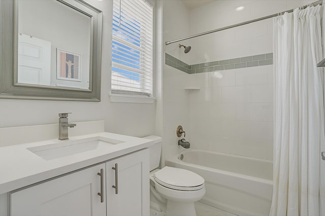 full bathroom featuring shower / bath combo with shower curtain, vanity, and toilet