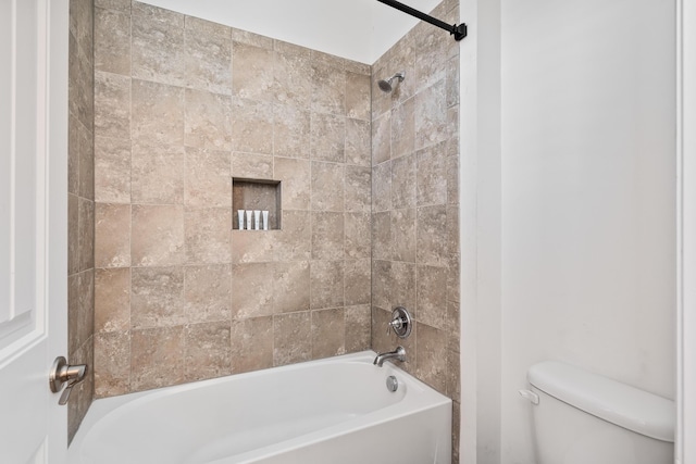 full bathroom featuring tub / shower combination and toilet