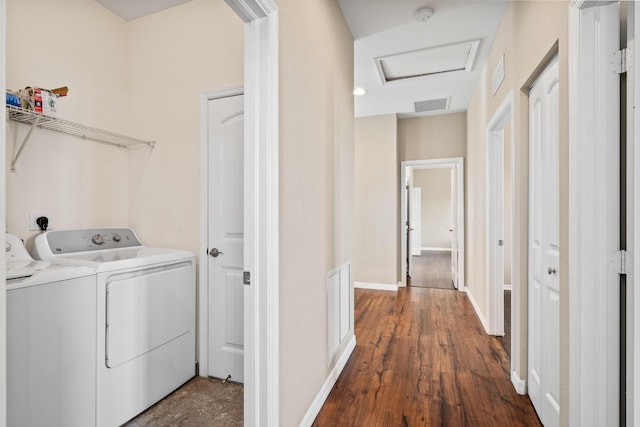 laundry area featuring baseboards, separate washer and dryer, visible vents, and attic access