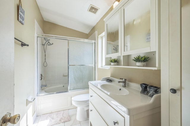 full bathroom featuring vanity, tile patterned floors, vaulted ceiling, toilet, and enclosed tub / shower combo