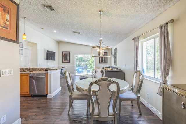 dining area with a textured ceiling, dark hardwood / wood-style flooring, a healthy amount of sunlight, and lofted ceiling