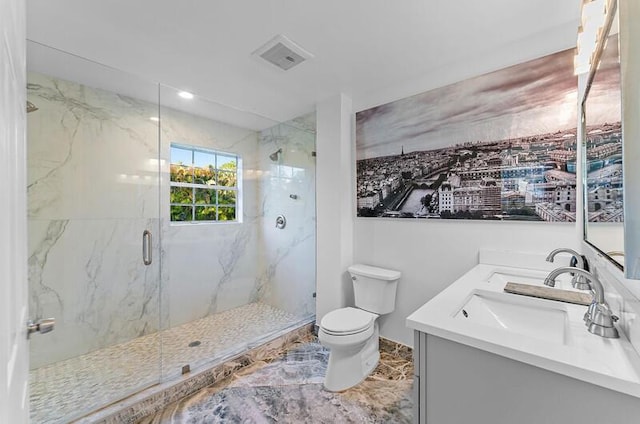 bathroom featuring vanity, toilet, and an enclosed shower