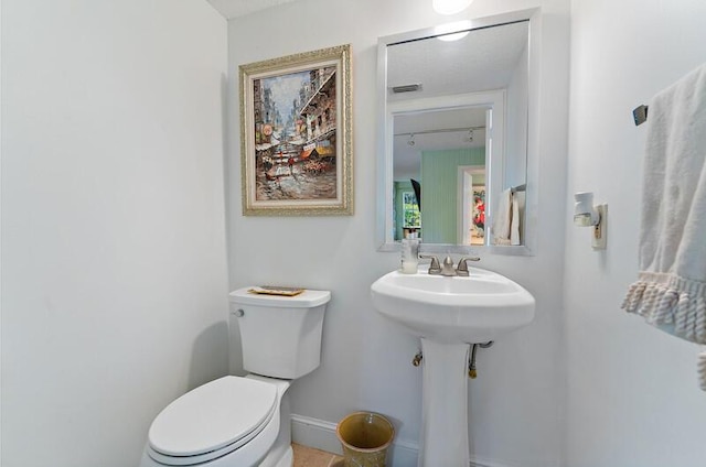 bathroom featuring toilet