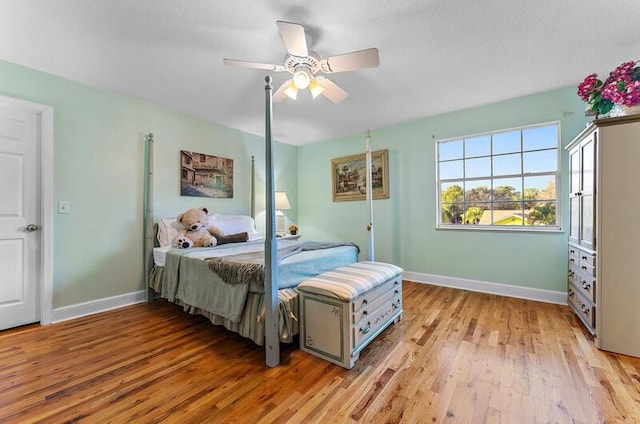 bedroom featuring ceiling fan and light hardwood / wood-style flooring