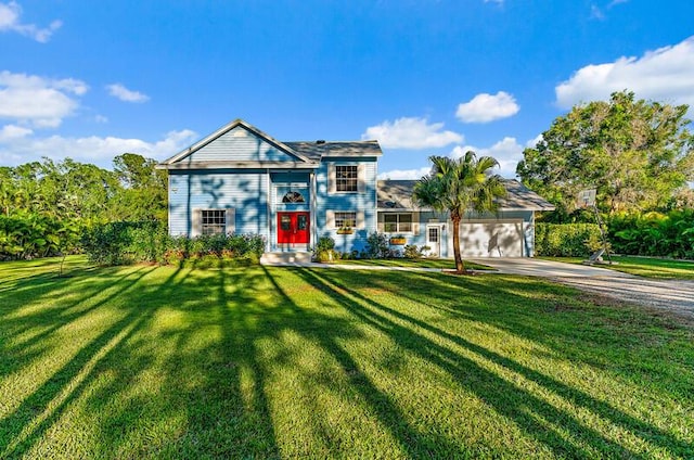 view of front of home featuring a garage and a front lawn