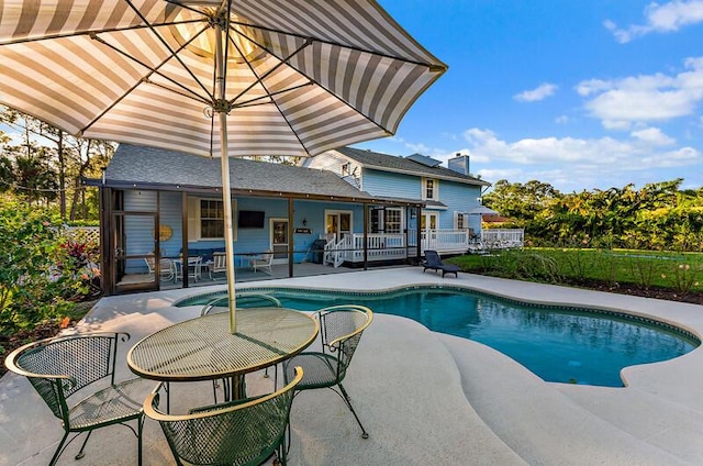 view of pool featuring a patio