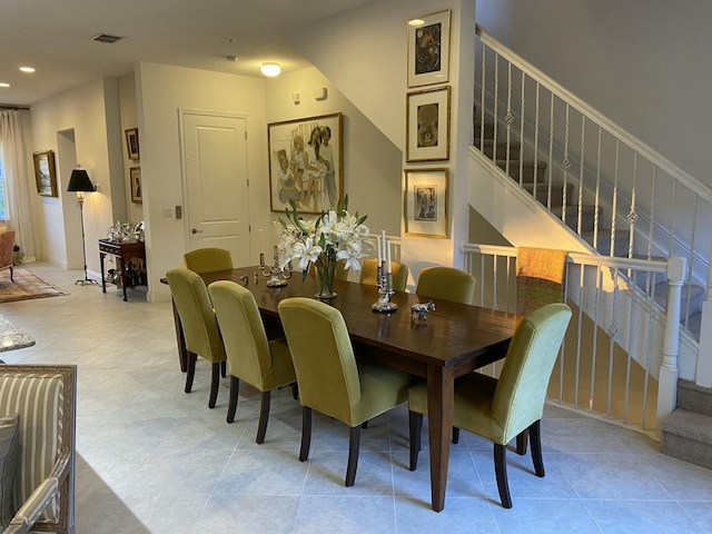 dining area with light tile patterned floors