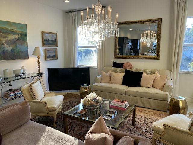 living room with a chandelier and plenty of natural light