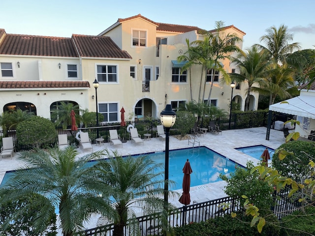 view of pool featuring a gazebo, a patio, and a community hot tub