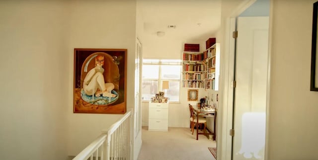 corridor with light colored carpet