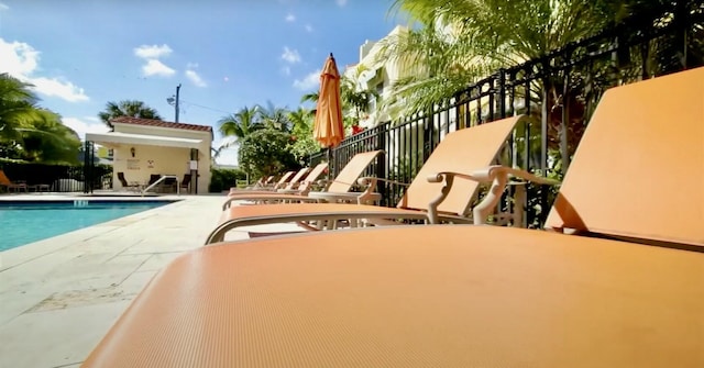 view of swimming pool with a patio area