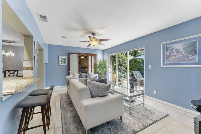 bedroom with light carpet, multiple windows, and ceiling fan