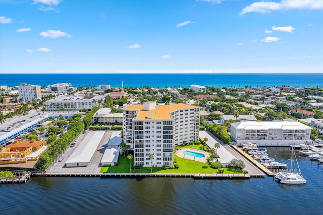 birds eye view of property with a water view