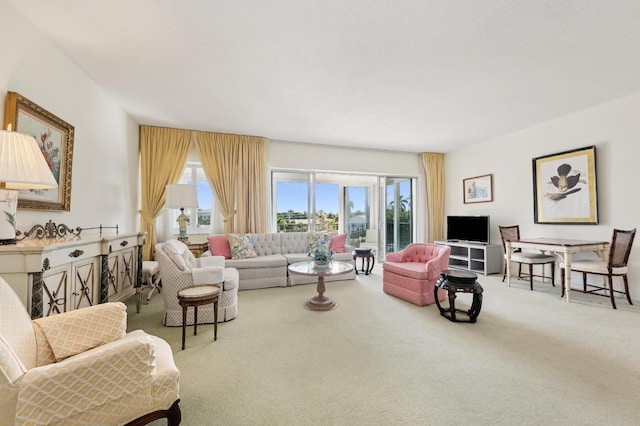 living room with a wealth of natural light and carpet