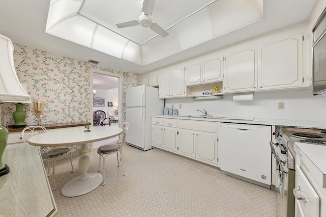 kitchen featuring ceiling fan, white cabinetry, white appliances, and sink