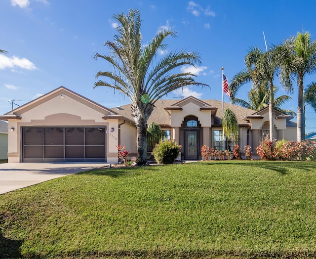 ranch-style home with a front yard and a garage