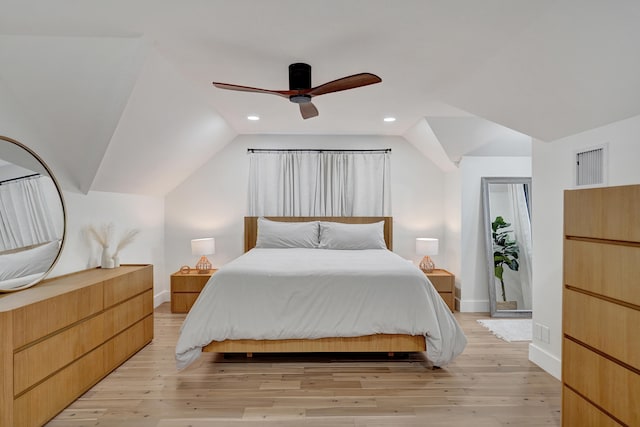 bedroom with vaulted ceiling, ceiling fan, and light hardwood / wood-style flooring