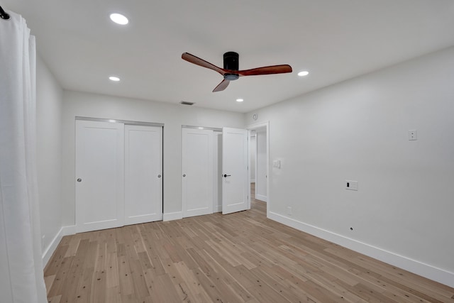 unfurnished bedroom with light wood-type flooring and ceiling fan