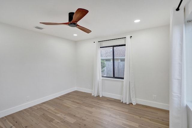 spare room with ceiling fan and light hardwood / wood-style flooring