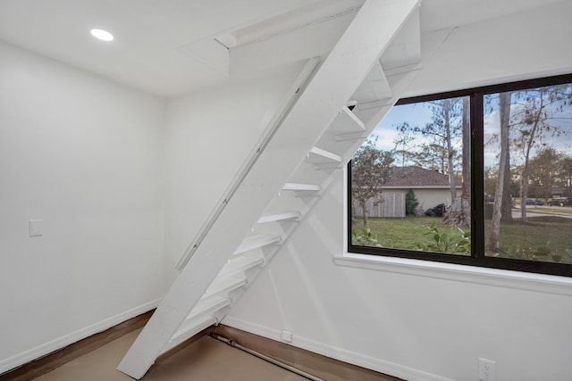 stairway with wood-type flooring