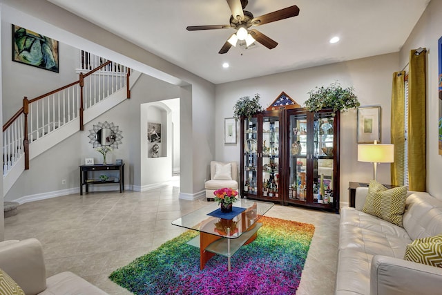 tiled living room with ceiling fan