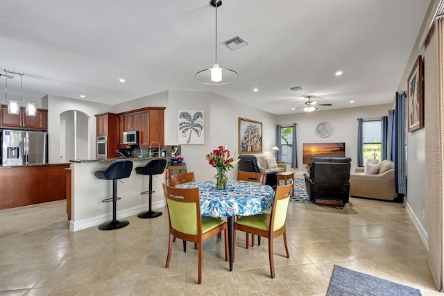 dining area with ceiling fan