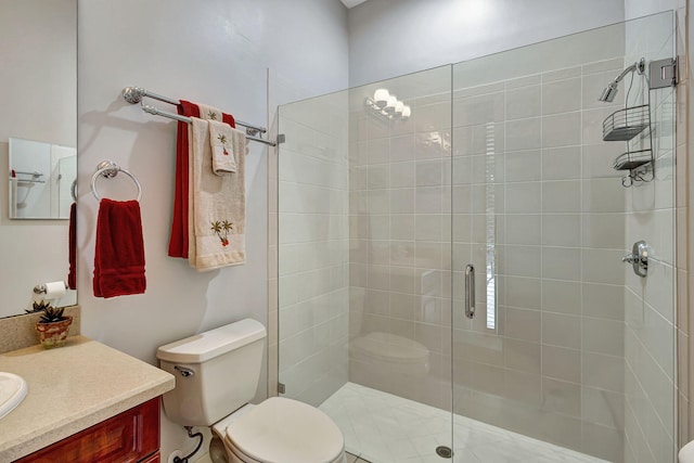 bathroom featuring walk in shower, vanity, and toilet