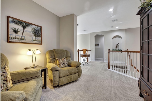 sitting room with light colored carpet