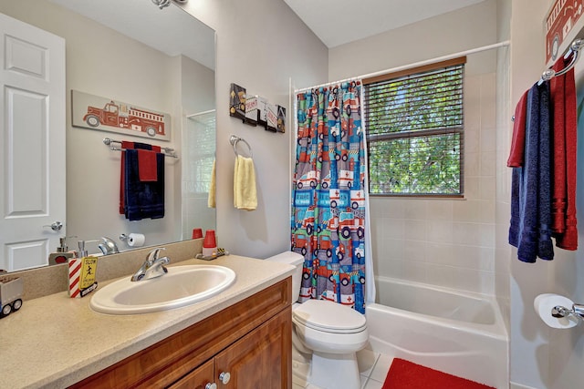 full bathroom featuring vanity, toilet, tile patterned flooring, and shower / tub combo