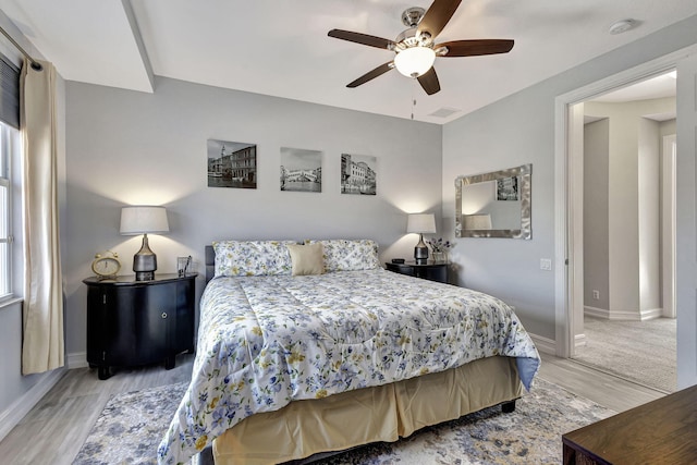 bedroom featuring light wood-type flooring and ceiling fan