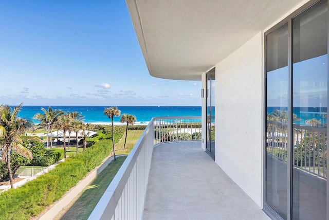 balcony featuring a water view