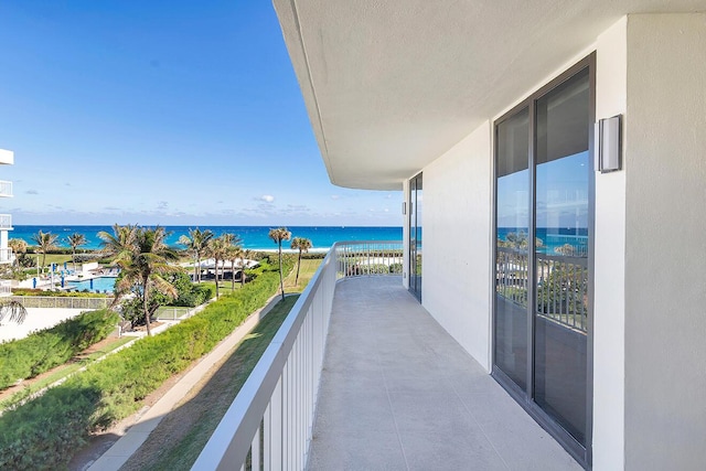 balcony featuring a water view