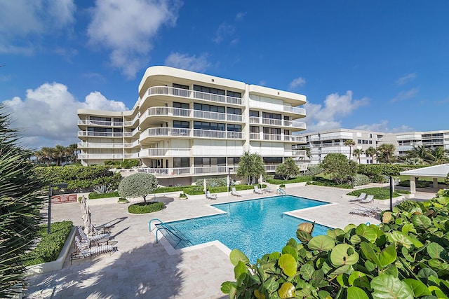 view of swimming pool with a patio area