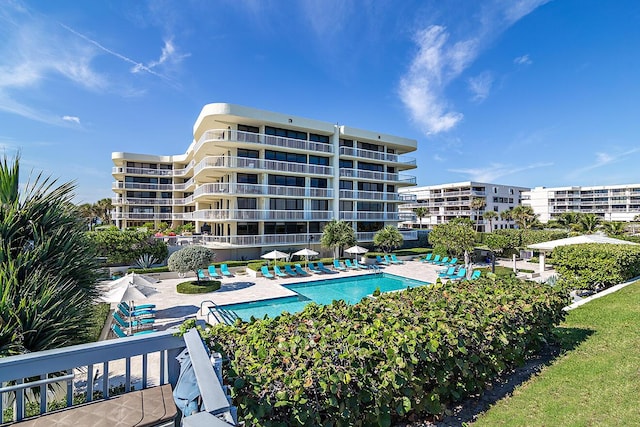 view of swimming pool with a patio area