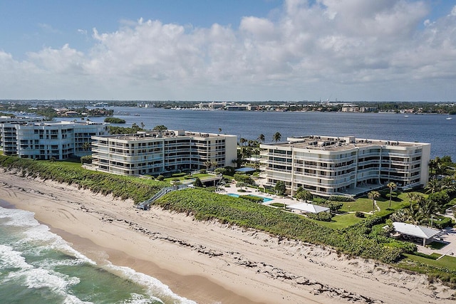 bird's eye view featuring a water view and a view of the beach