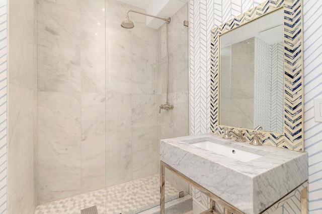 bathroom featuring sink and tiled shower