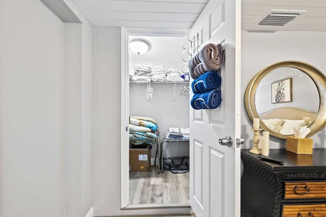 spacious closet featuring hardwood / wood-style floors