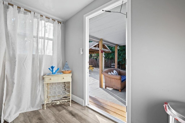 5219 NE 20th Ter, Pompano Beach, FL 33064 - doorway with baseboards and wood finished floors