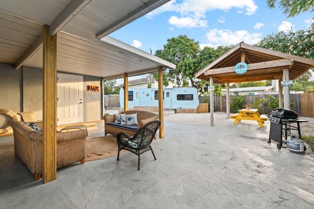5219 NE 20th Ter, Pompano Beach, FL 33064 - view of patio / terrace featuring fence, grilling area, an outdoor structure, and an outdoor living space