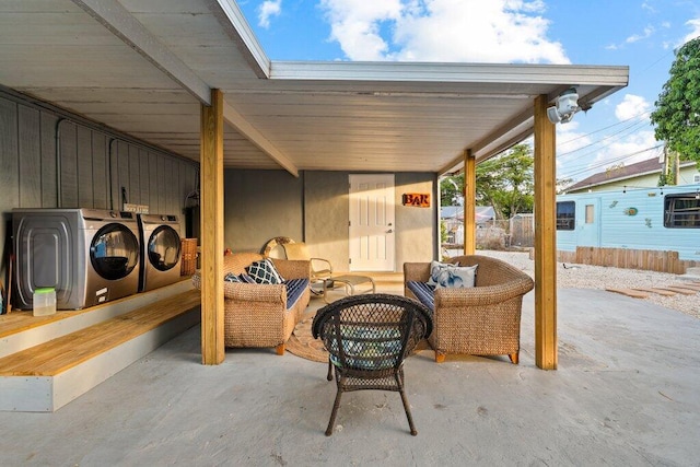 5219 NE 20th Ter, Pompano Beach, FL 33064 - view of patio / terrace with washing machine and dryer and outdoor lounge area