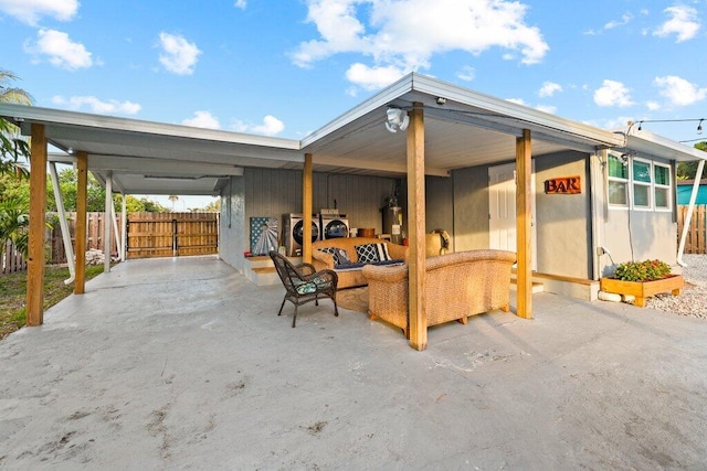 exterior space featuring washing machine and clothes dryer