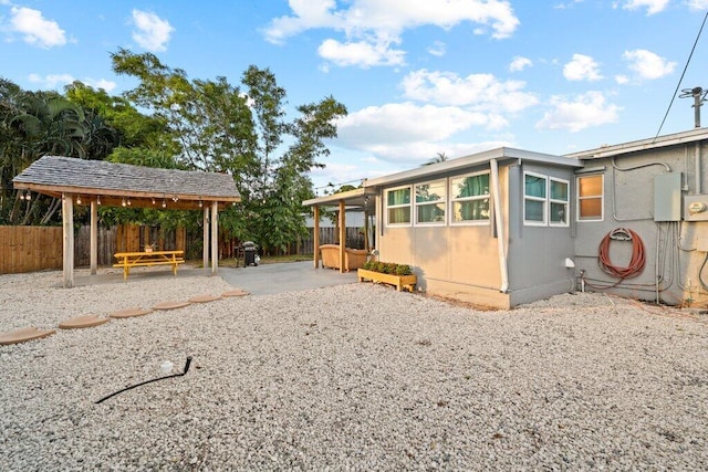 5219 NE 20th Ter, Pompano Beach, FL 33064 - view of front of home with a gazebo, a patio, and fence