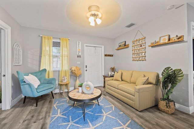 5219 NE 20th Ter, Pompano Beach, FL 33064 - living area with baseboards, wood finished floors, visible vents, and a ceiling fan
