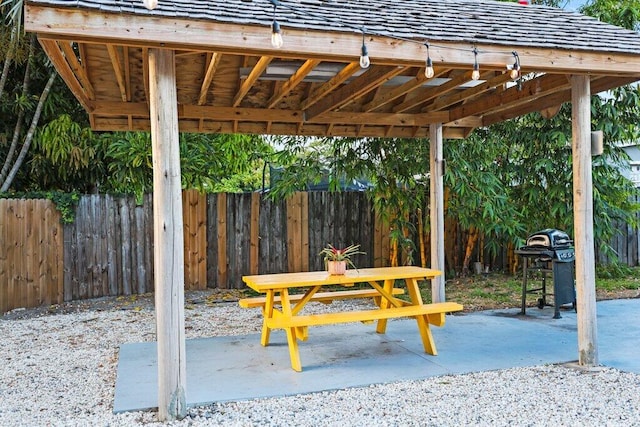 5219 NE 20th Ter, Pompano Beach, FL 33064 - view of patio featuring fence, a carport, and area for grilling