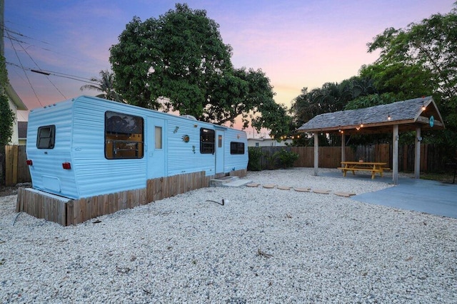 5219 NE 20th Ter, Pompano Beach, FL 33064 - view of front of home with fence, a patio area, and a gazebo