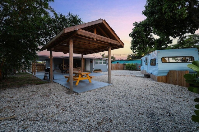 view of patio terrace at dusk