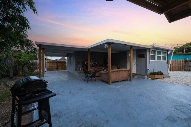 5219 NE 20th Ter, Pompano Beach, FL 33064 - view of front of home with a fenced backyard, outdoor lounge area, and a patio area