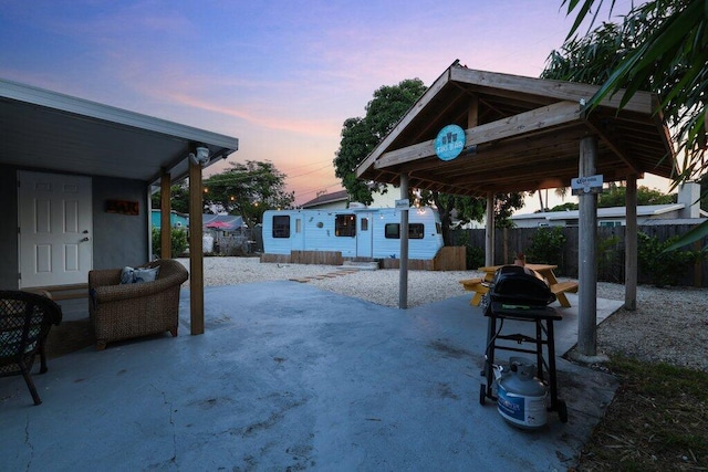 patio terrace at dusk with an outdoor structure