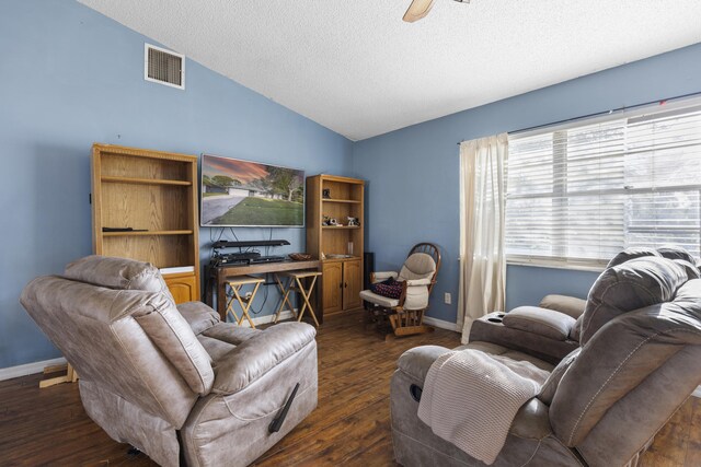 carpeted bedroom with ceiling fan and a textured ceiling